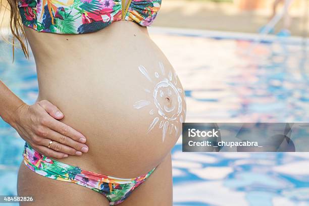 Sun Shape Picture On Pregnant Belly Stock Photo - Download Image Now - 2015, Beach, Beautiful People