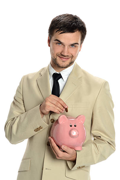 istock Young Man with Piggy Bank 484583750