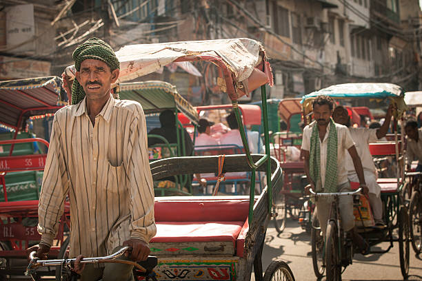 Cycle rickshaws on the street of Old Delhi, India stock photo
