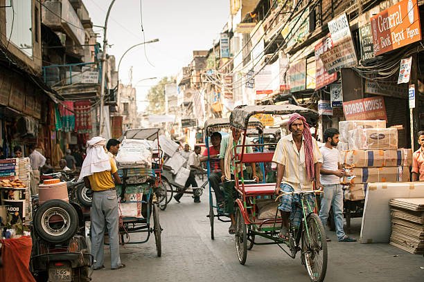 Cycle rickshaws on the street of Old Delhi, India stock photo