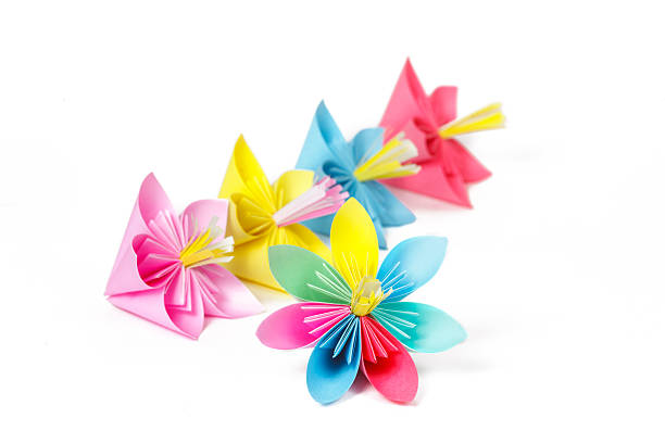 istock Five colored paper flowers and flower with varicolored petals 484584783