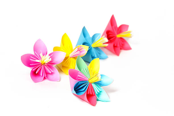 istock Five colored paper flowers and flower with varicolored petals 484584785