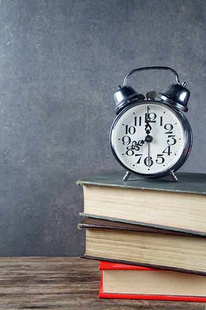 istock Back to school background with books and alarm clock 484586978