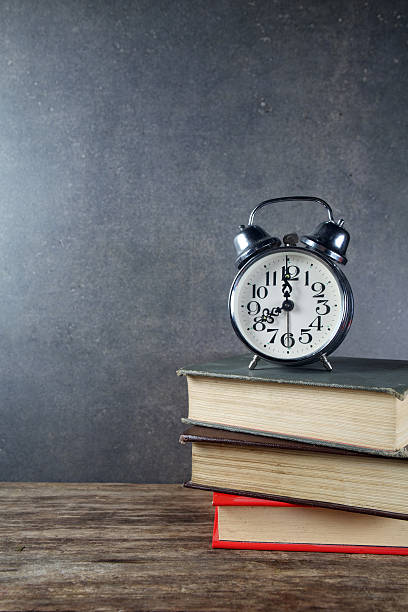 istock Back to school background with books and alarm clock 484586984
