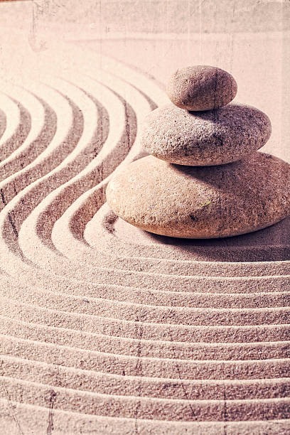 istock contrasted effect for zen mindset with pebbles and sand 484587998