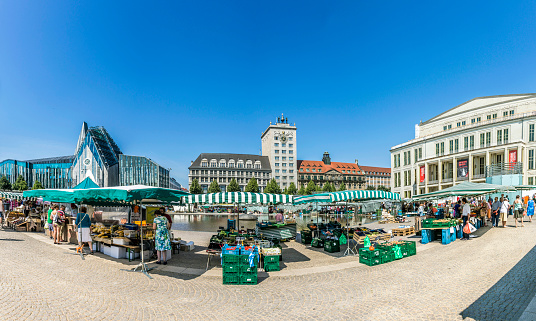 Leipzig, Germany - August 4, 2015: Old Town Hall in Leipzig with people at marketplace. In about 1165, Leipzig was granted municipal status and market privileges.