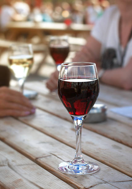 istock Glass of red wine on the table 484588382