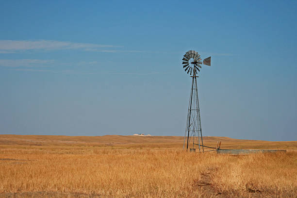 istock Windmill pumping water in Fairburn South Dakota 484589790