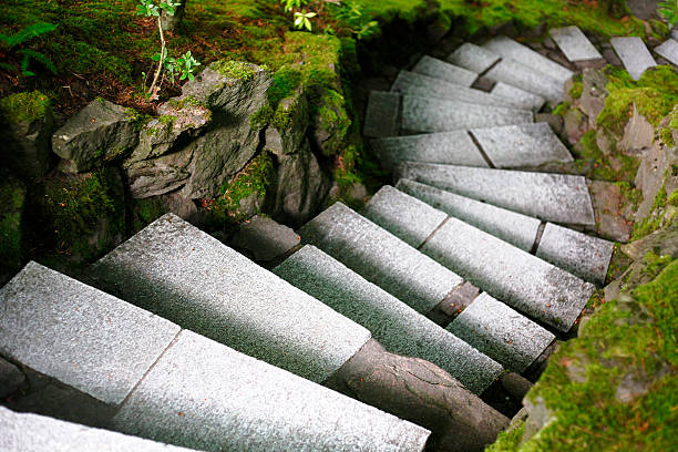 istock Descending Stairs Cut Through Mossy Green Rocks 484590968