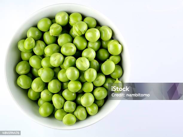 Green Peas In The Bowl Isolated On White Stock Photo - Download Image Now - Green Pea, Bowl, 2015