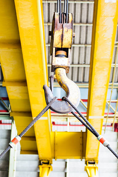 istock Industrial yellow crane and  hook 484602395