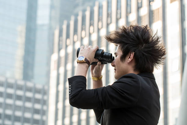 istock Businessman search stock through binoculars 484603416