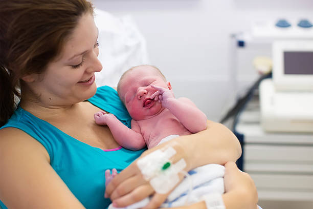 istock Young mother giving birth to a baby 484603700