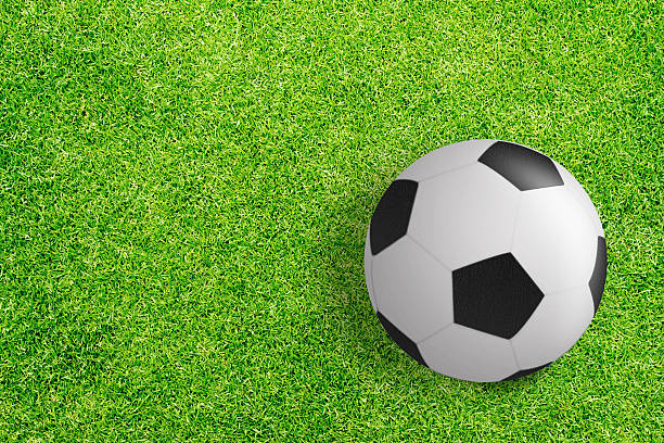 istock soccer ball on green grass texture background 484605417
