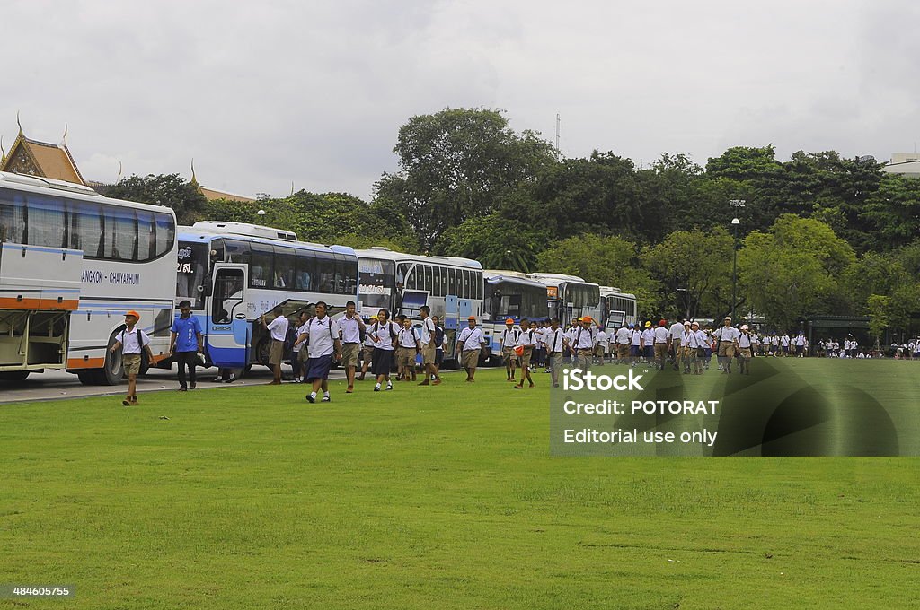 Children in Sanam Luang Bangkok, Thailand - September 18, 2013: After reviewing the field trip.Children relax in a field(Sanam Luang). Agricultural Field Stock Photo