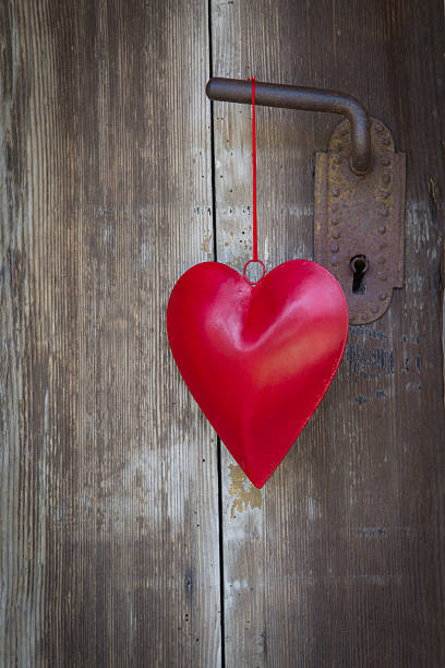 istock Heart shape hanging on door handle for valentine, christmas. 484606319