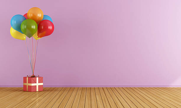 istock Colorful balloons in a empty pink room 484607689