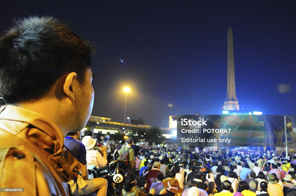 Anti-government protester in Thailand Bangkok, Thailand - December 22, 2013:Anti-government protesters listen to a speech from Thai protest leader at Victory Monument in central of Bangkok. Activist Stock Photo