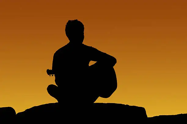 Photo of Silhouette man playing guitar