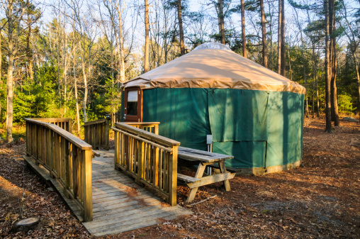 Handicapped accessable camping yurt with a wide wheelchair ramp at a state forest campground on Cape Cod.