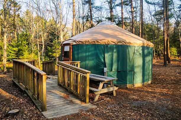 Camping Yurt Handicapped accessable camping yurt with a wide wheelchair ramp at a state forest campground on Cape Cod. yurt photos stock pictures, royalty-free photos & images
