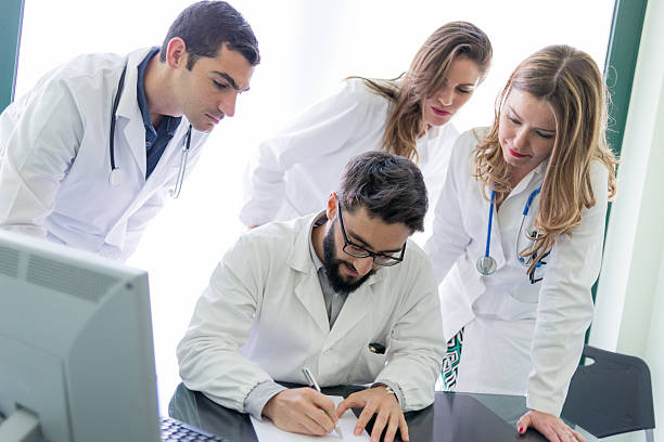 istock Group of doctors at the medical office 484610280