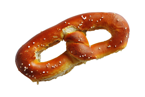 Shot of whole Philadelphia-style soft pretzel isolated on a white background.