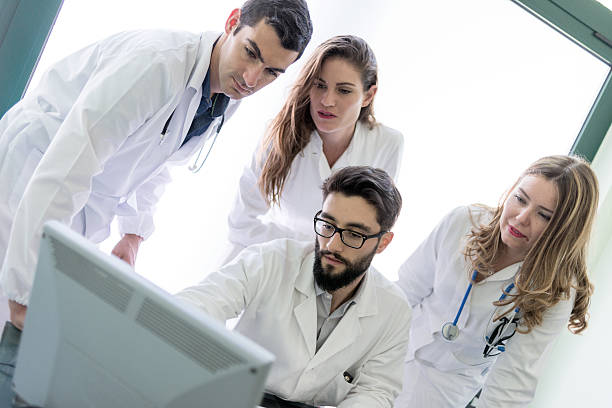 istock Group of doctors at the medical office 484616206