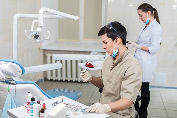 istock Dentist curing a female patient 484617031