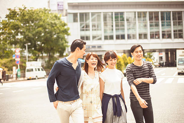 istock Young people  walking against cityscape 484617650