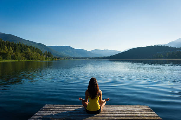 istock Easy Pose Tranquil Lakeside meditation at sunrise 484617936