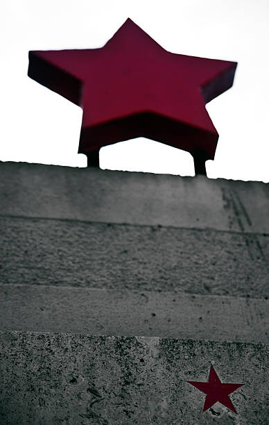 istock red star on a concrete fence 484620115