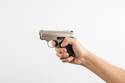 Gun in Hand , isolated on white