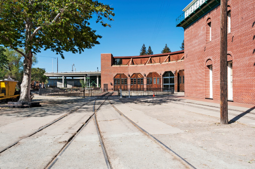 This is the entrance of the Old Sacramento Historic Roundhouse, Showing the tracks to the Turntable and the openings to the Roundhouse.
