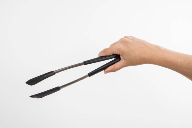 istock Kitchen Tongs in Hand 484622195