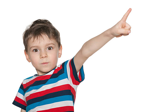 istock Surprised little boy shows his finger aside 484622747