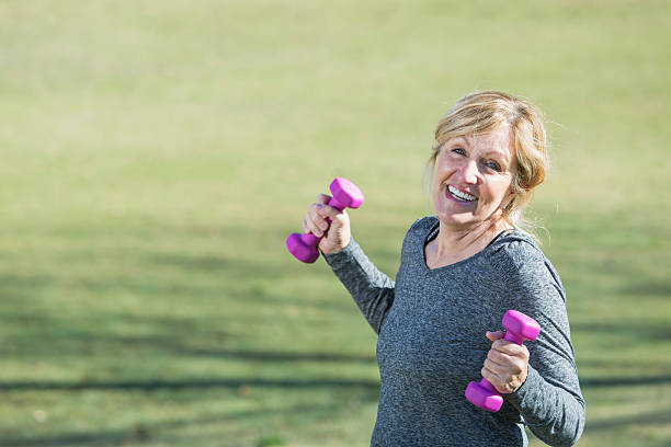istock Senior woman exercising 484622903