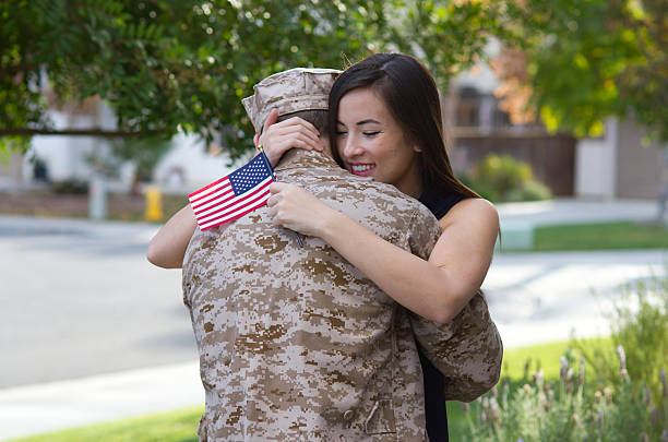 Military Man Returns From Deployment Horizontal Shot in Murrieta, California in November of 2013. military deployment photos stock pictures, royalty-free photos & images