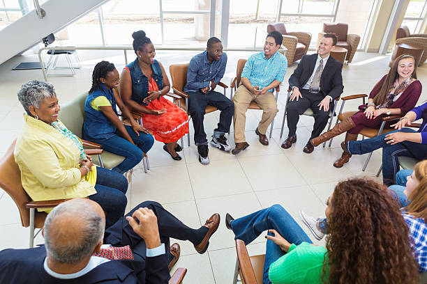 istock Diverse group of people in a meeting together 484622991