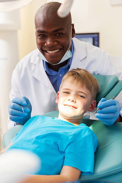 istock young patient getting dental treatment 484624114