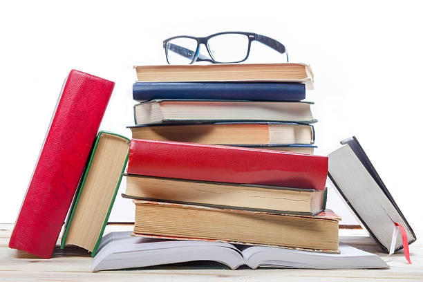 istock Stack of colorful books on wooden table. Back to school. 484625626