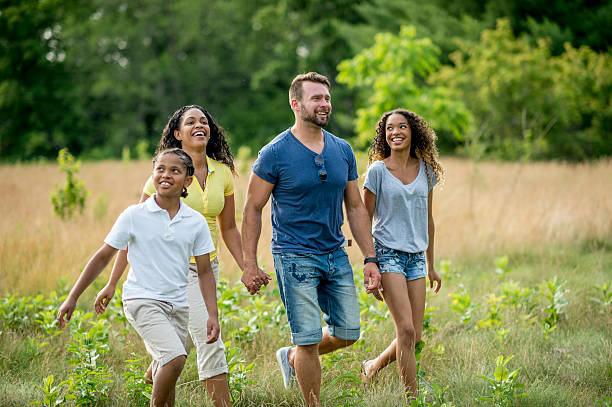 istock Family Holding Hands and Laughing 484626042