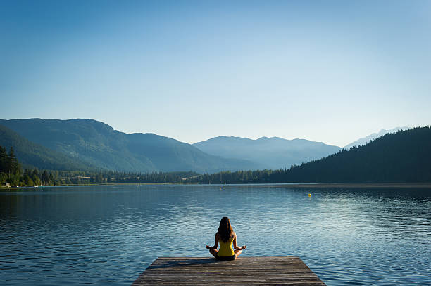 istock Easy Pose Tranquil Lakeside meditation at sunrise 484626072