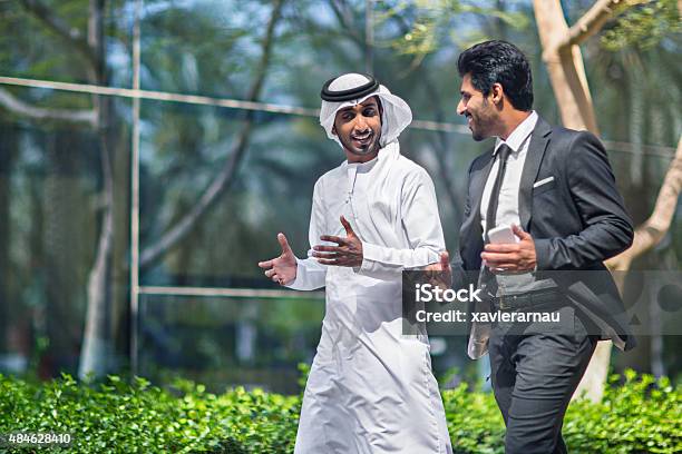 Middle Eastern Businessmen Talking In The Street Stock Photo - Download Image Now - United Arab Emirates, Middle Eastern Ethnicity, Arabia