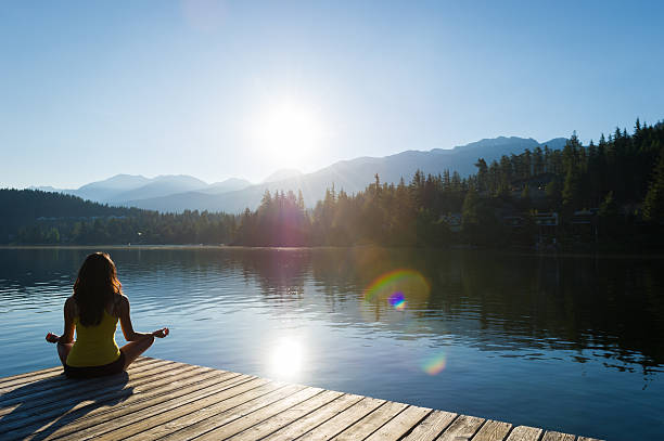 istock Easy Pose Tranquil Lakeside meditation at sunrise 484628662