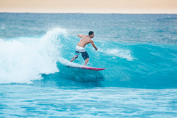 istock Surfer Surfing in Kauai Hawaii 484628814