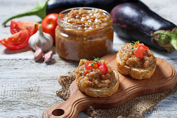 Bread toasts with eggplant caviar Bread toasts with eggplant caviar. Selective focus caviar stock pictures, royalty-free photos & images