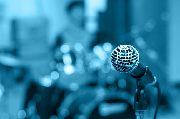 istock Close up of microphone on musician blurred background 484633608