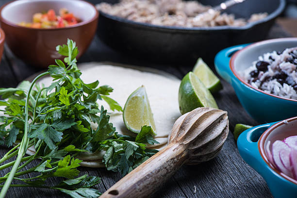 Making traditional mexican burritos with pulled beef