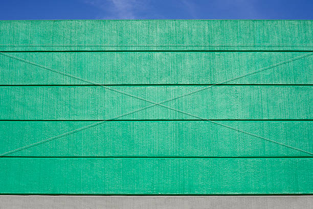 istock Concrete green noise protection wall against blue sky 484638798